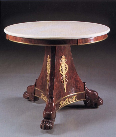 19th Century FRENCH, Late Empire Ormolu-Mounted Mahogany Center Table, 1810-1815
Mahogany, 30 x 38 1/8 x 38 1/4 in. (76.2 x 96.8 x 97.2 cm)
Circular white mottled marble top above the plain frieze fitted with later brass border raised on a canted tripartite support fitted with ormolu flaming torches within a laurel wreath on paw feet.
FRE-003-FU